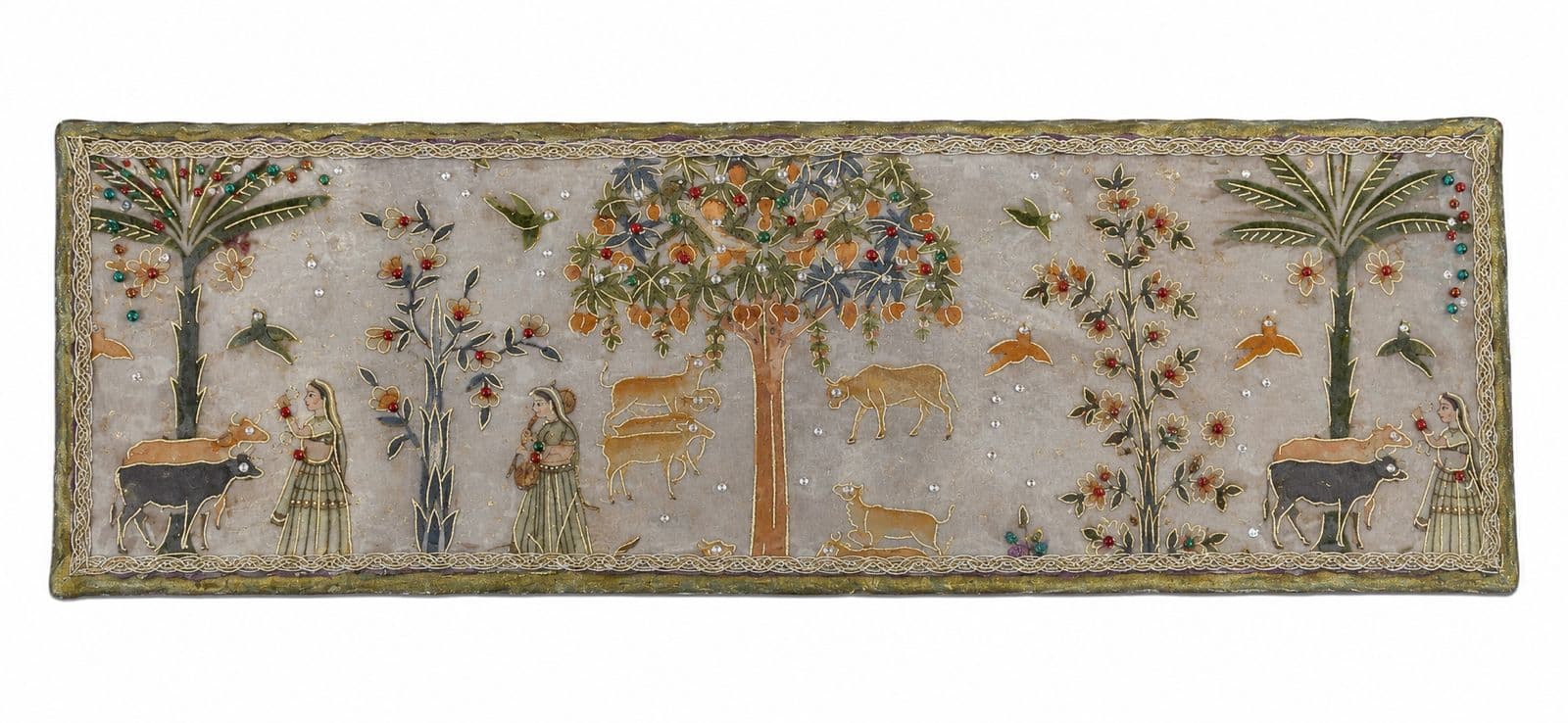 Embroidered pichwai panel showing cows, gopis and flowering trees on a cream ground